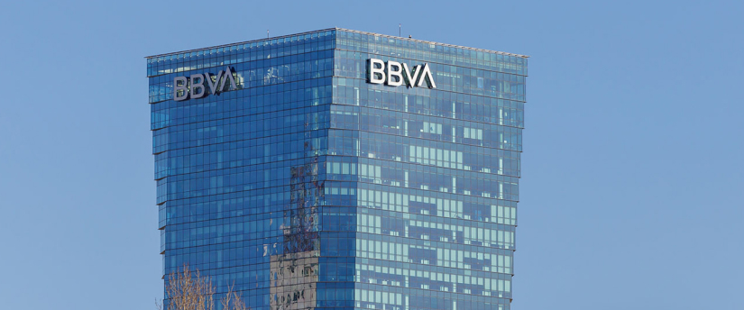 A towering structure adorned with a clock, symbolizing both height and the passage of time in an urban landscape.
