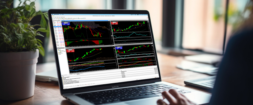  Persona analizando datos de trading en una laptop, con gráficos y estadísticas visibles en la pantalla.